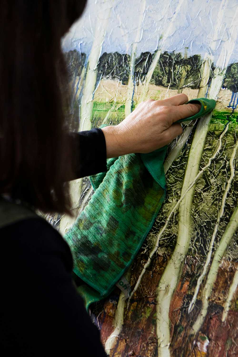 Artist in the studio. Painter Rose Wilson demonstrating her unique oil painting techniques